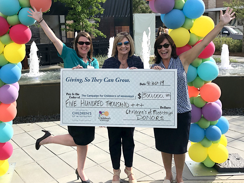 Celebrating $500,000 raised during Giving TWOsday are, from left, Natalie Hutto, UMMC executive director of development; Dr. LouAnn Woodward, vice chancellor for health affairs and dean of the School of Medicine; and Dr. Mary Taylor, Suzan B. Thames Chair, professor and chair of Pediatrics. The amount raised surpassed $500,000 and was then matched by an anonymous donor.